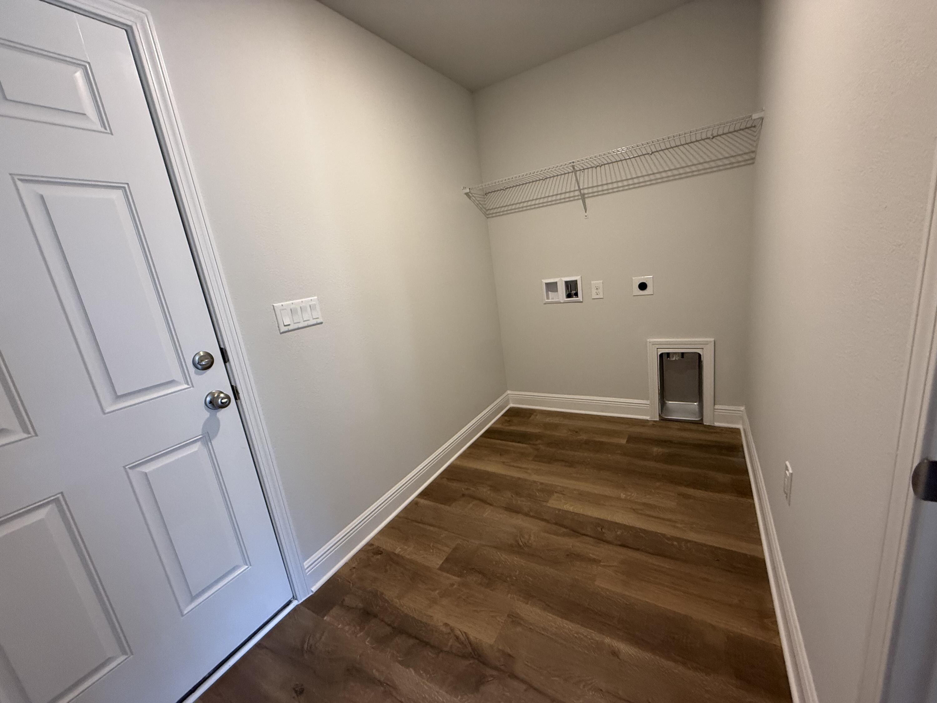 6011 Crocket Cove Crestview, FL 32539 - Photo 12 of 18 a view of a room with wooden floor and white walls