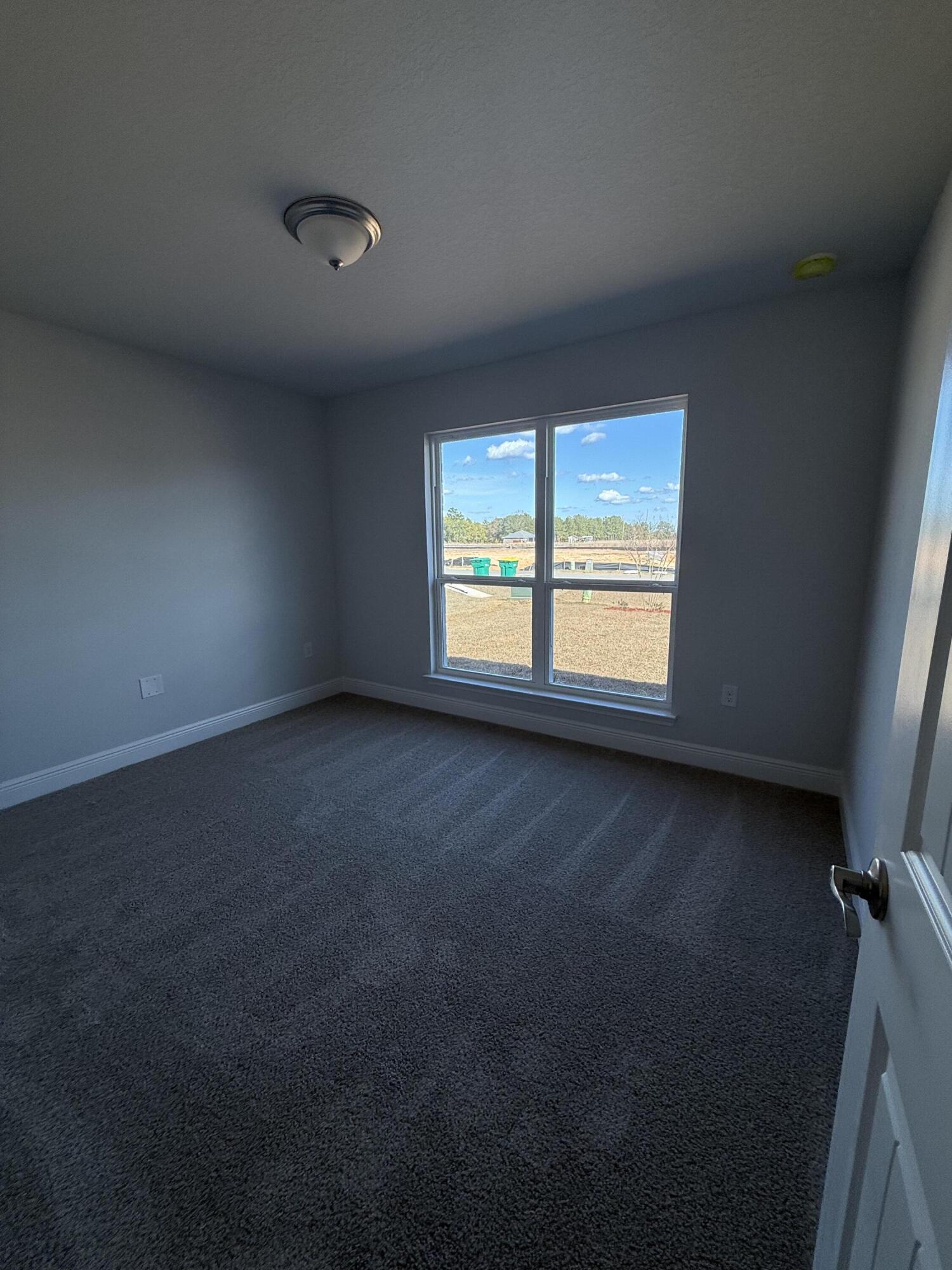 6011 Crocket Cove Crestview, FL 32539 - Photo 8 of 18 a view of an empty room with a window