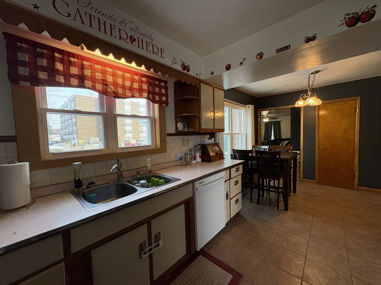 913 Canal Street Ottawa, IL 61350 - Photo 12 of 30 a kitchen with stainless steel appliances granite countertop sink window and dining table