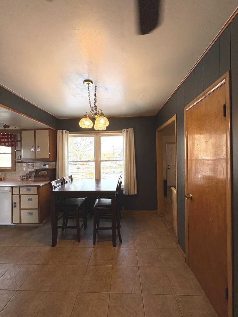 913 Canal Street Ottawa, IL 61350 - Photo 15 of 30 a view of a dining room with furniture window and outside view