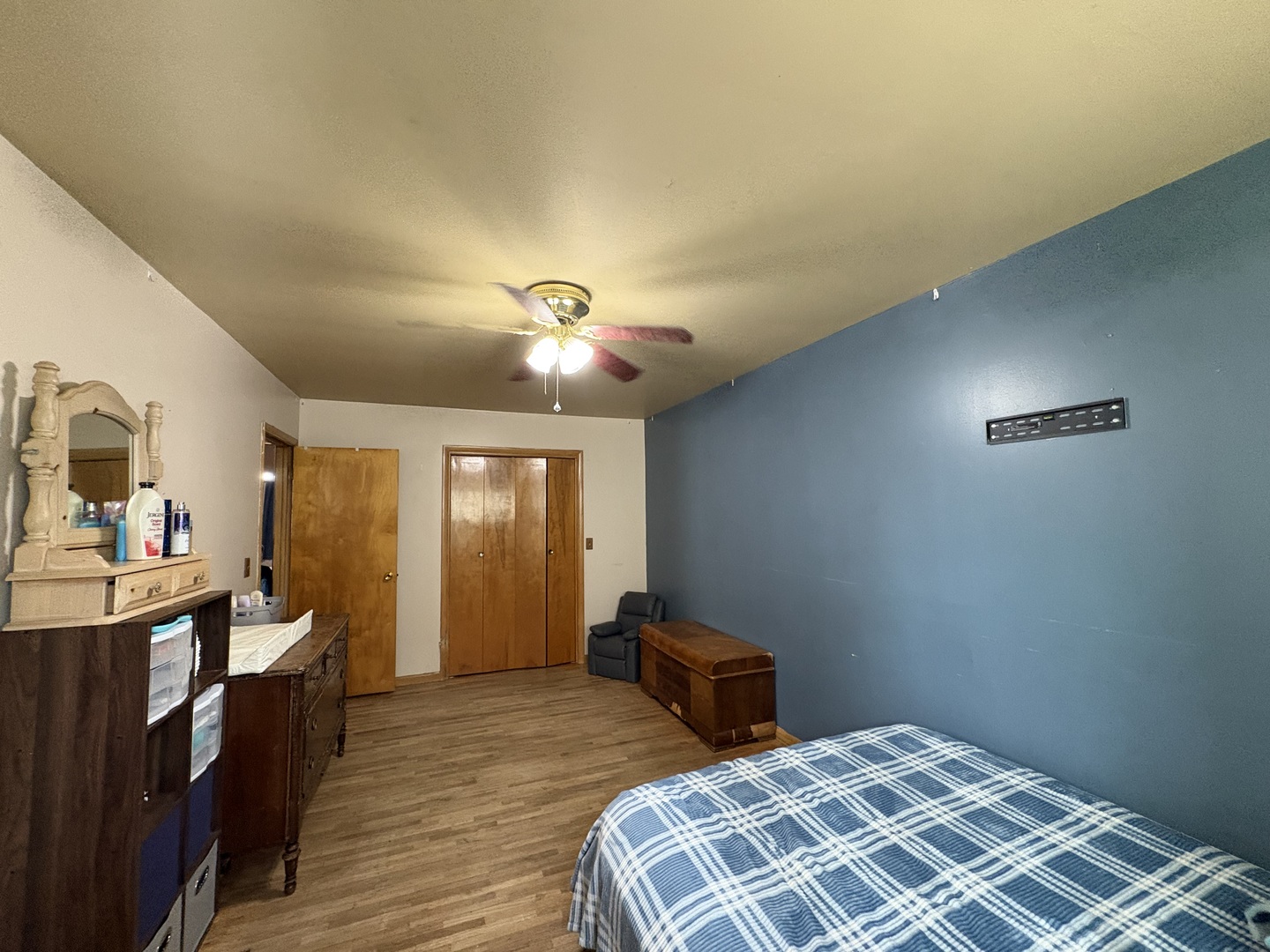 913 Canal Street Ottawa, IL 61350 - Photo 18 of 30 a bedroom with a bed and wooden floor