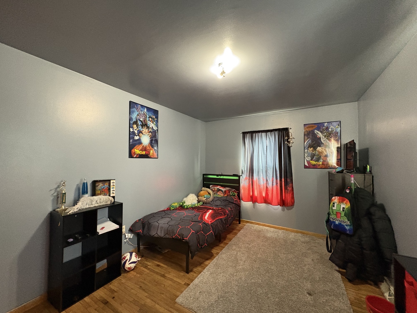 913 Canal Street Ottawa, IL 61350 - Photo 19 of 30 a bedroom with a bed and wooden floor