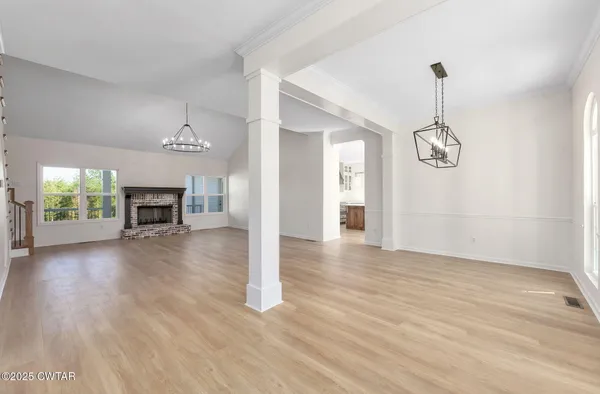 a kitchen with a stove a sink and a refrigerator