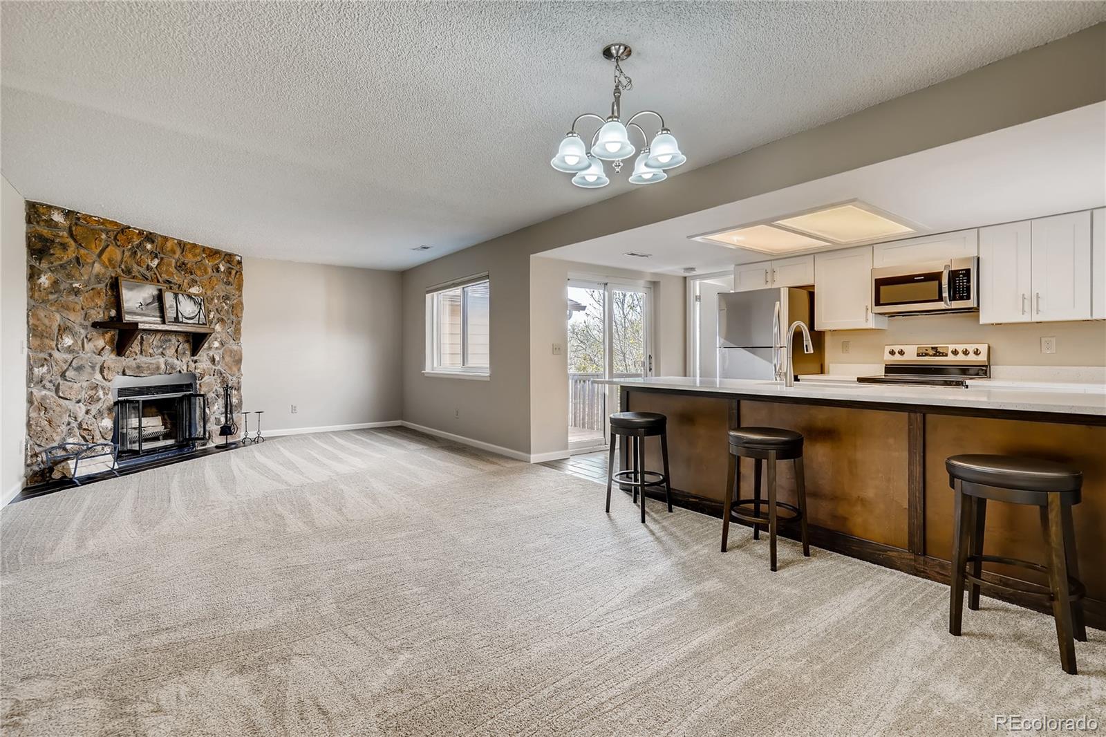9412 West 89th Circle Westminster, CO 80021 - Photo 3 of 10 a view of kitchen with furniture and chandelier