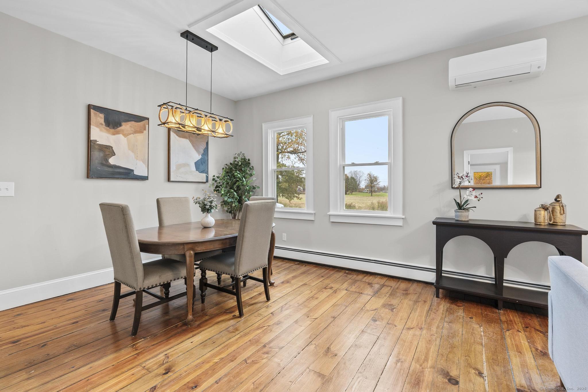 72 Spencer Street Suffield, CT 06078 - Photo 29 of 39 a view of a dining room with furniture window and wooden floor
