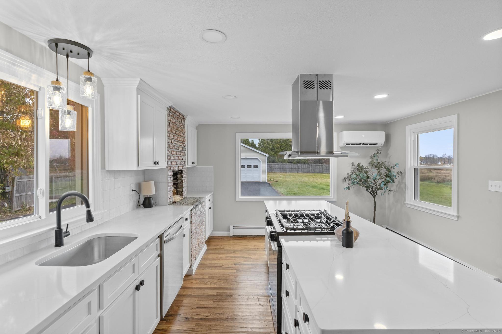 72 Spencer Street Suffield, CT 06078 - Photo 3 of 39 a kitchen with a sink stove and cabinets