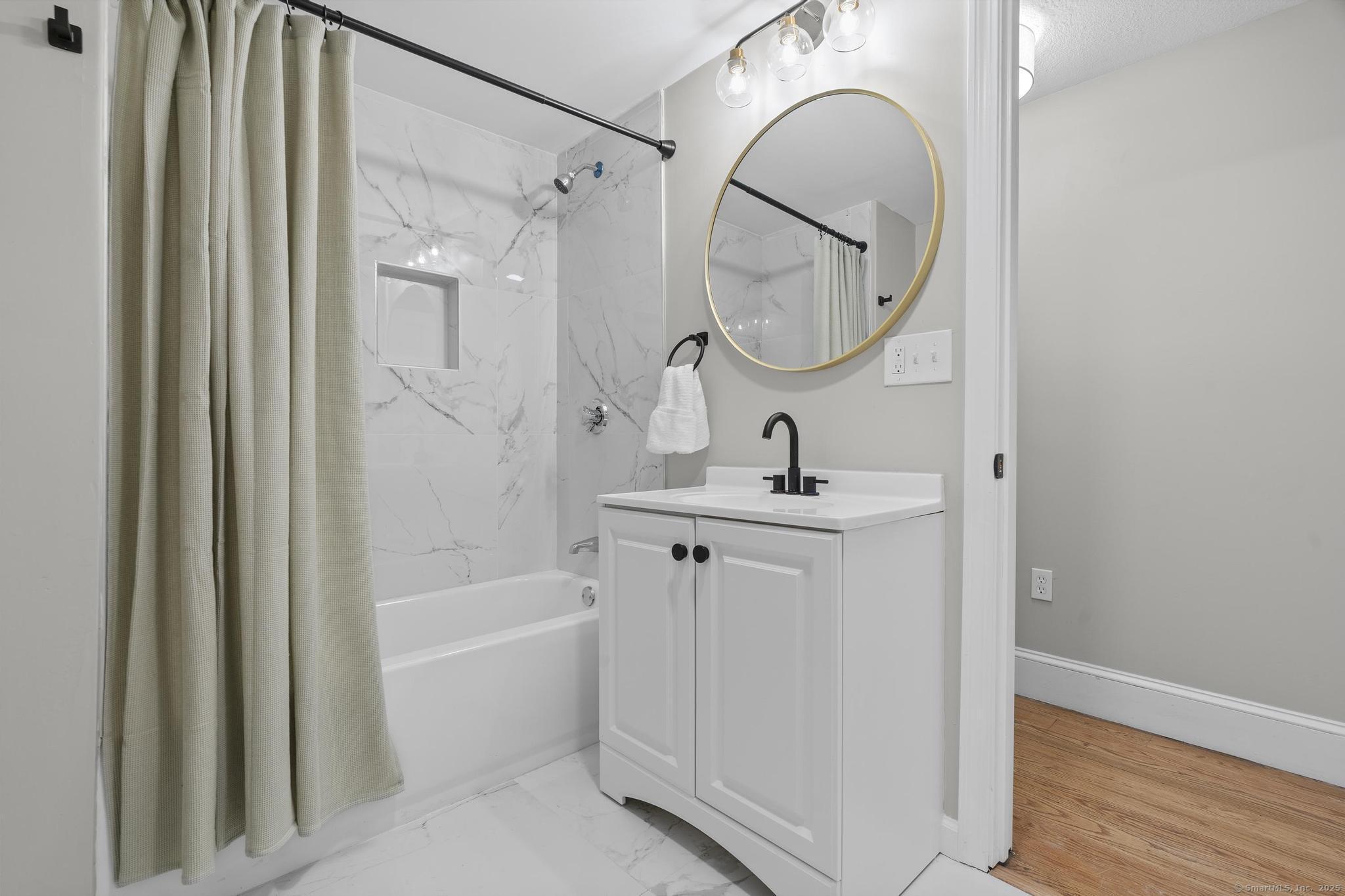 72 Spencer Street Suffield, CT 06078 - Photo 34 of 39 a bathroom with a mirror a sink and a mirror