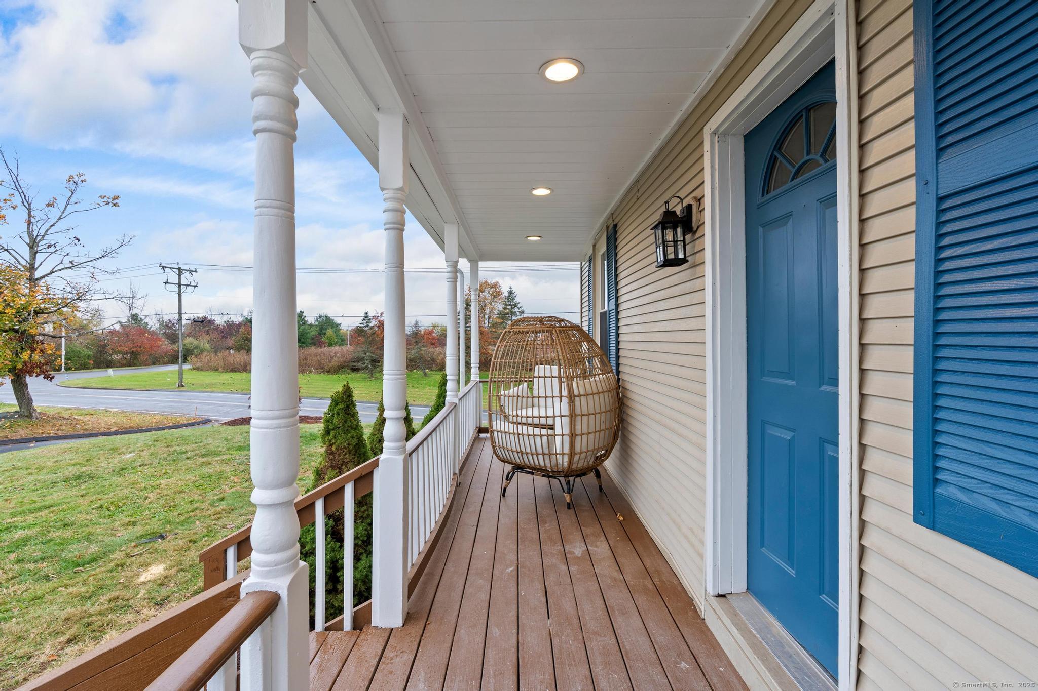 72 Spencer Street Suffield, CT 06078 - Photo 37 of 39 a view of a balcony with wooden floor