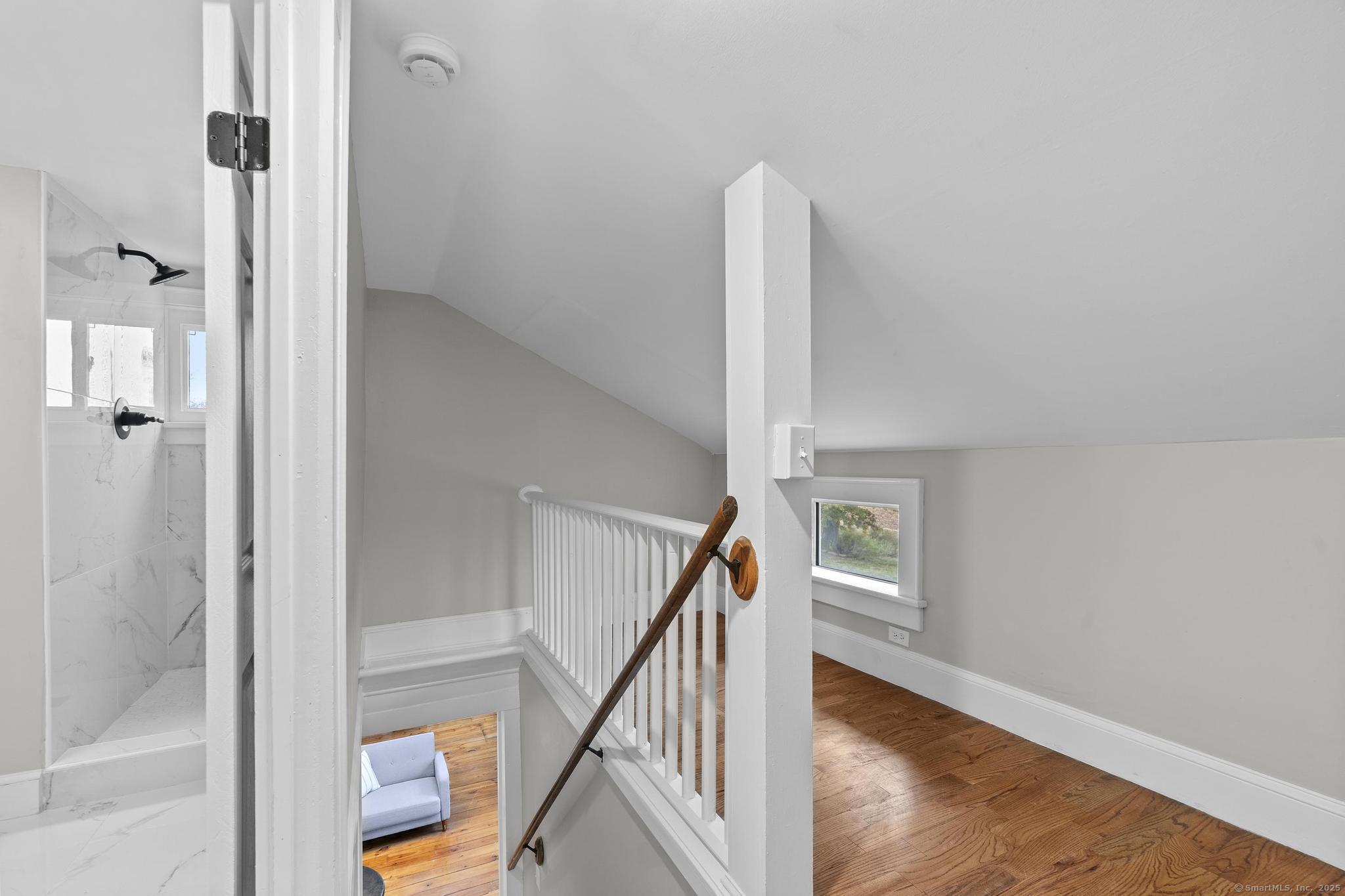 72 Spencer Street Suffield, CT 06078 - Photo 10 of 39 a view of a hallway with wooden floor and entryway