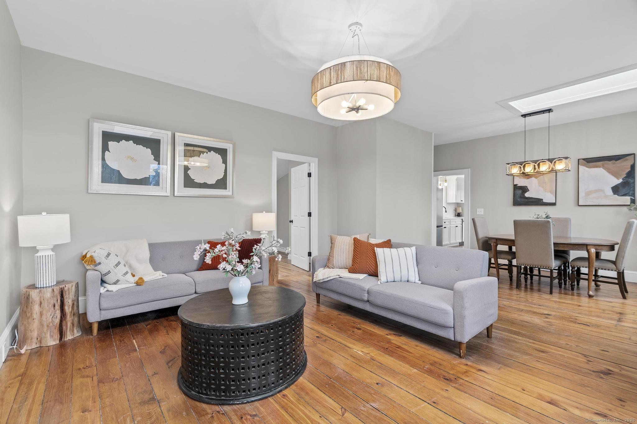 72 Spencer Street Suffield, CT 06078 - Photo 10 of 39 a living room with furniture potted plant and kitchen view