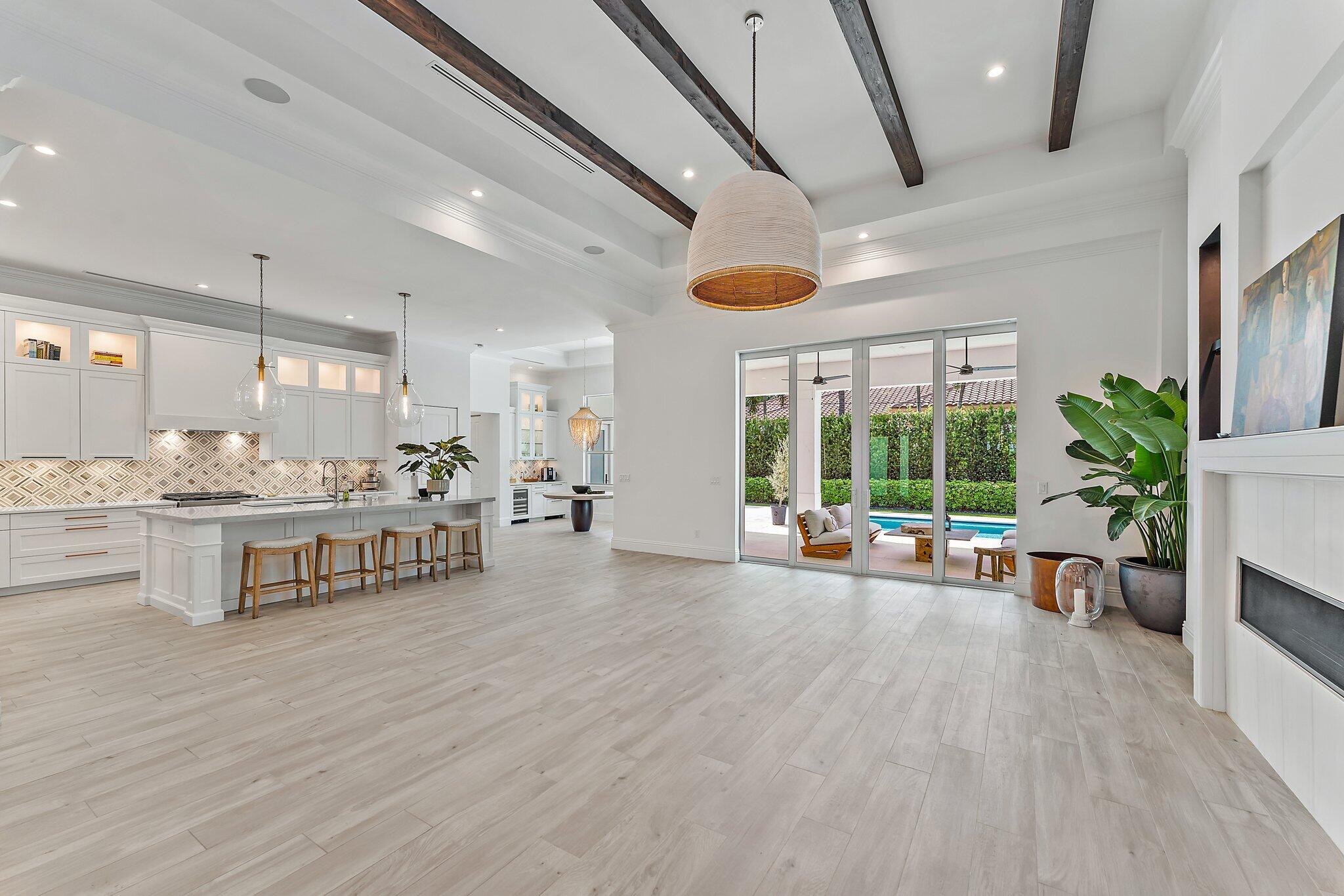 5456 Hibiscus Road Jupiter, FL 33458 - Photo 14 of 48 a living room with furniture and a large window
