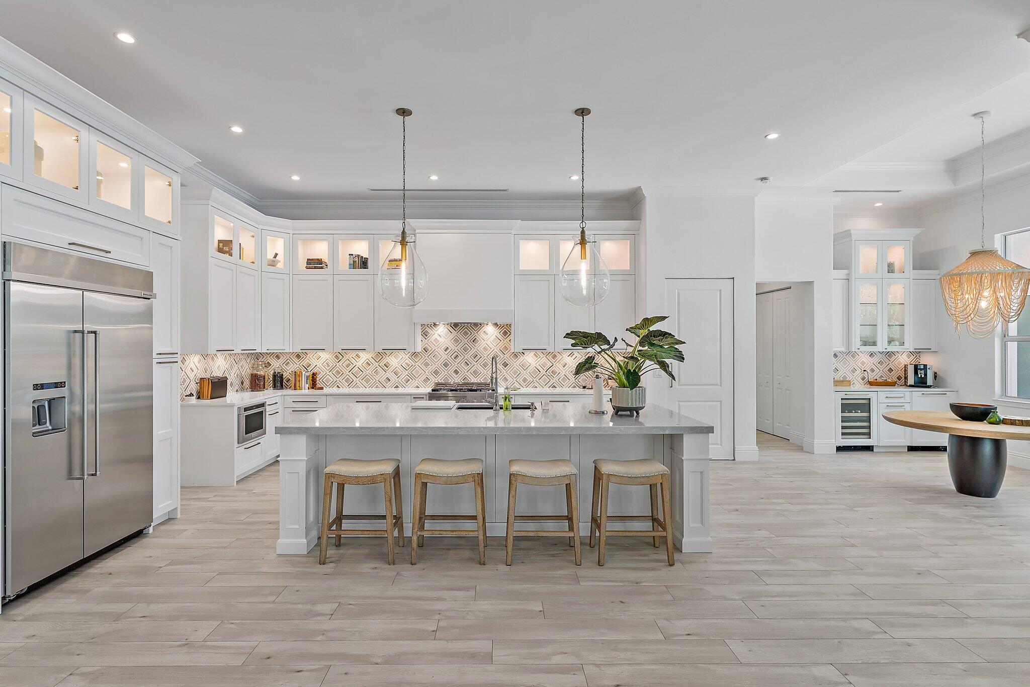 5456 Hibiscus Road Jupiter, FL 33458 - Photo 19 of 48 a view of a kitchen with dining table and chairs