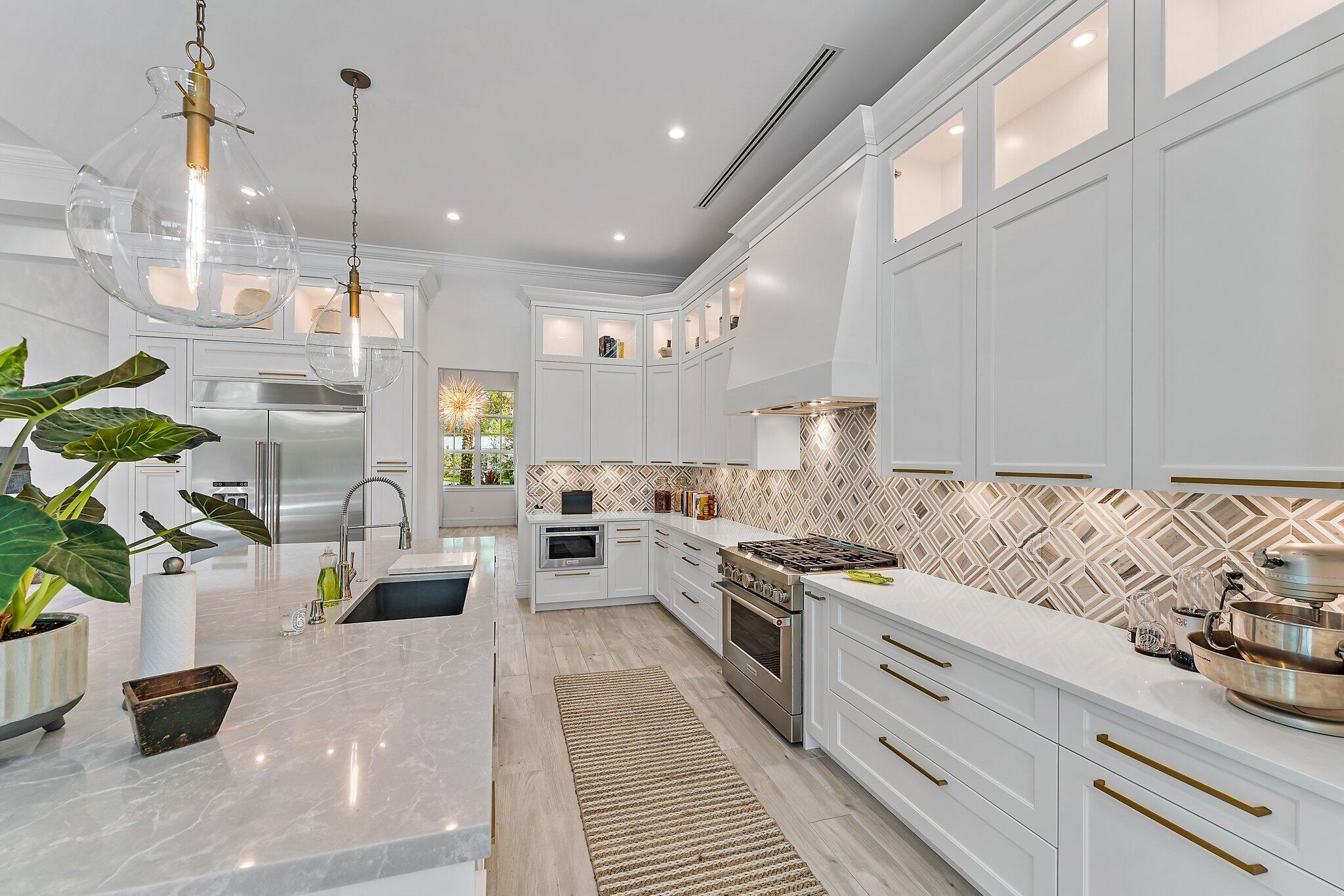 5456 Hibiscus Road Jupiter, FL 33458 - Photo 20 of 48 a kitchen with furniture and a view of living room