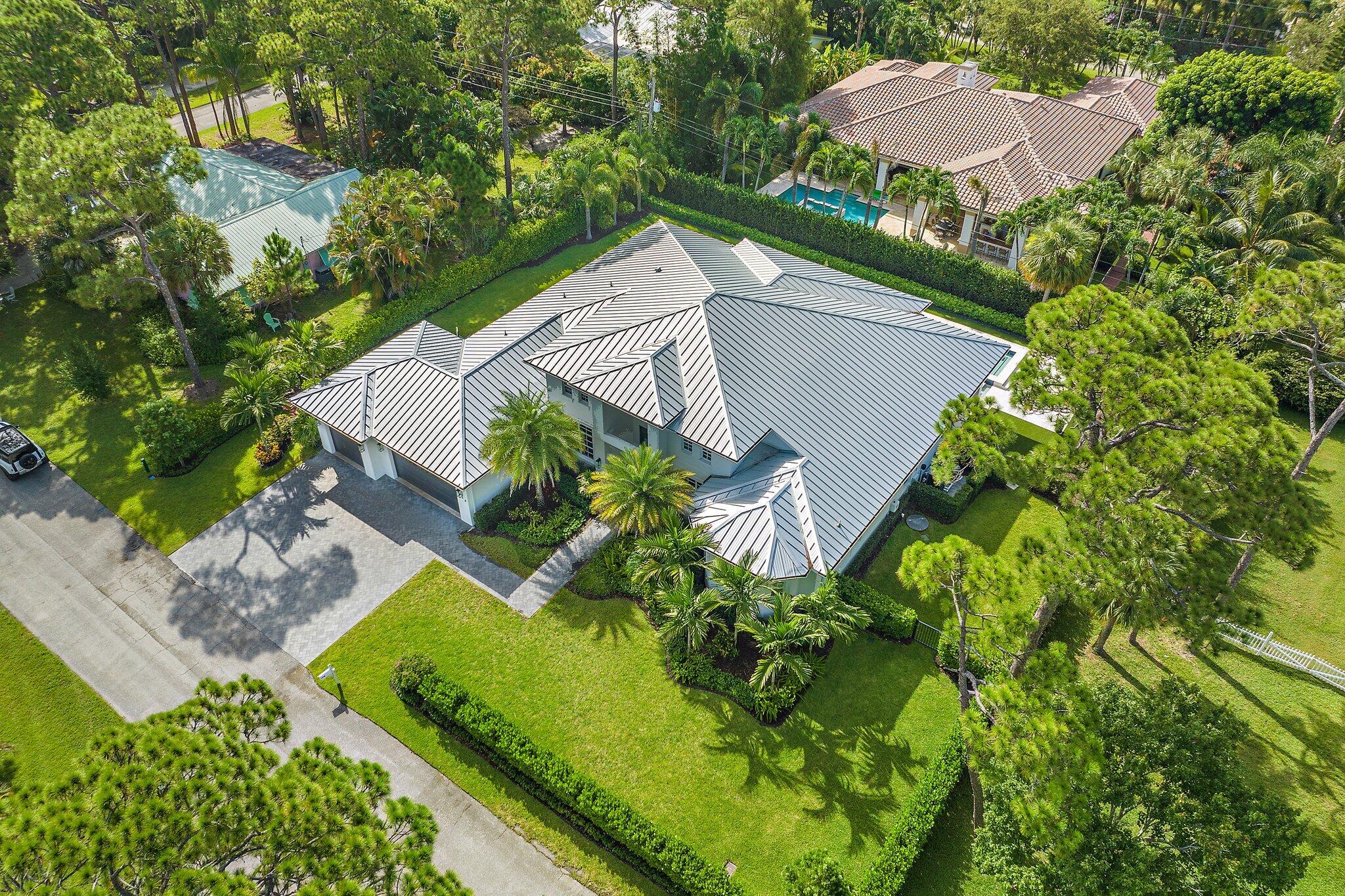 5456 Hibiscus Road Jupiter, FL 33458 - Photo 2 of 48 an aerial view of a house