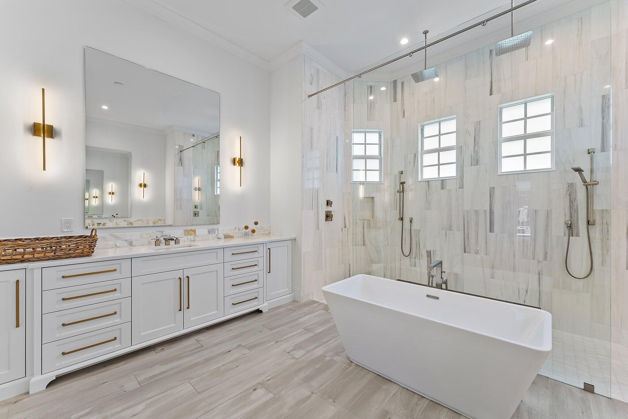 5456 Hibiscus Road Jupiter, FL 33458 - Photo 26 of 48 a bathroom with a granite countertop tub sink shower double vanity