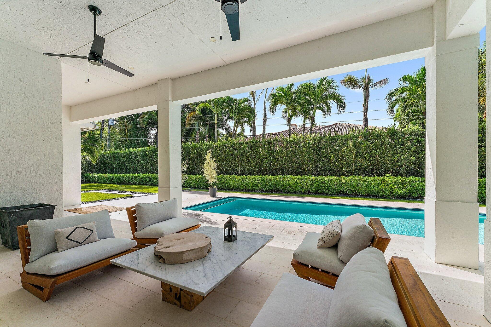 5456 Hibiscus Road Jupiter, FL 33458 - Photo 41 of 48 a living room with garden couch and windows