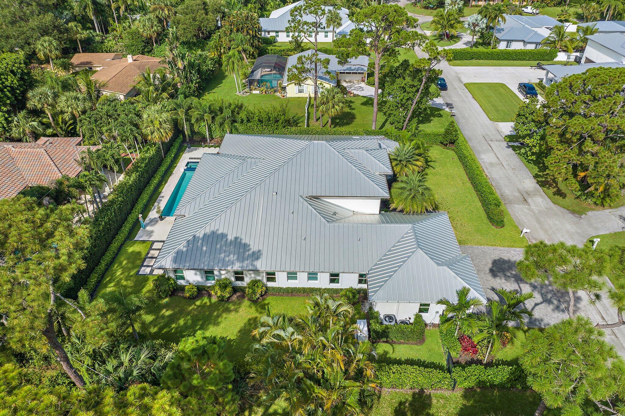 5456 Hibiscus Road Jupiter, FL 33458 - Photo 46 of 48 an aerial view of residential house with outdoor space and swimming pool