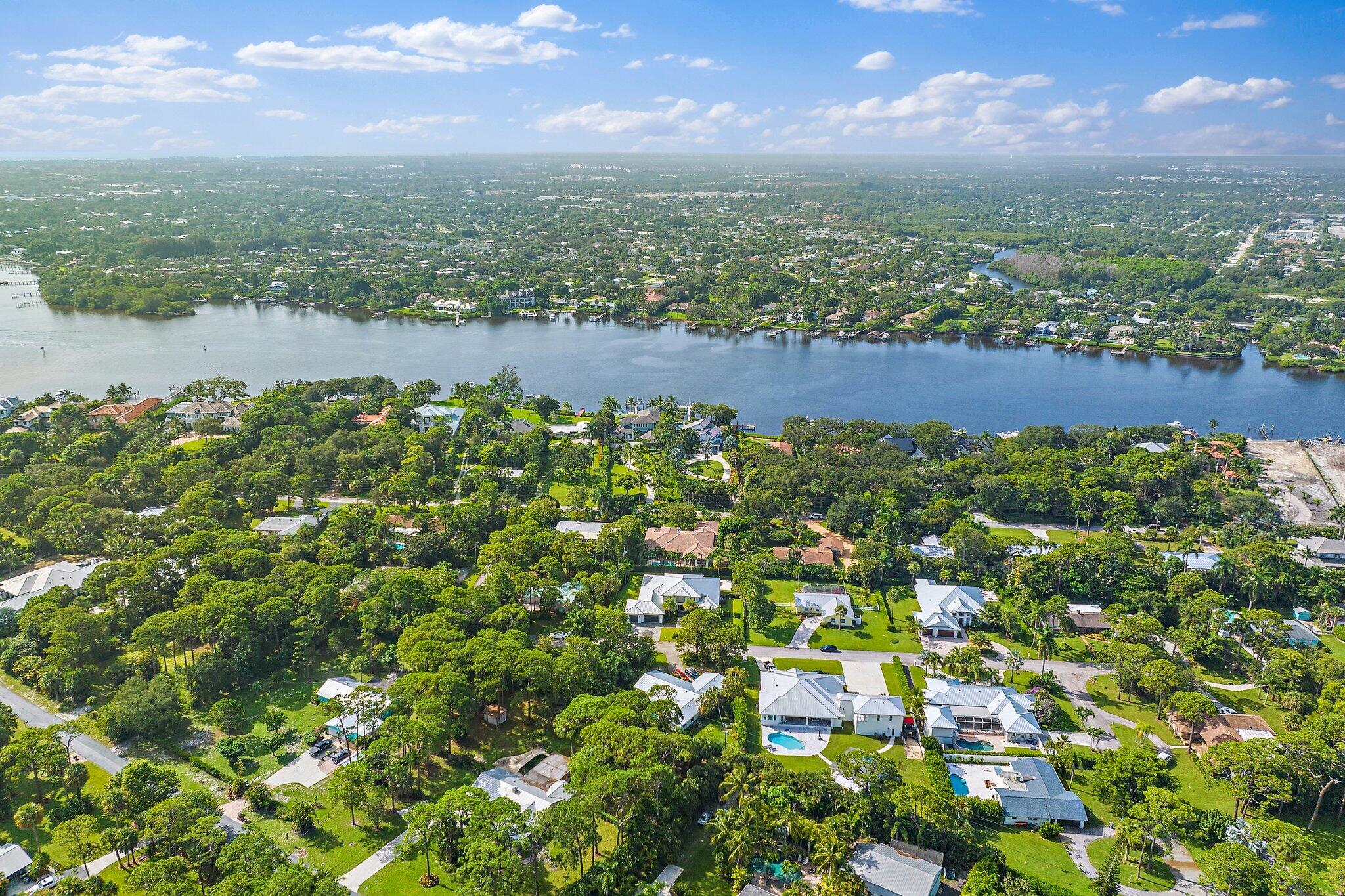 5456 Hibiscus Road Jupiter, FL 33458 - Photo 47 of 48 an aerial view of residential houses with outdoor space and trees