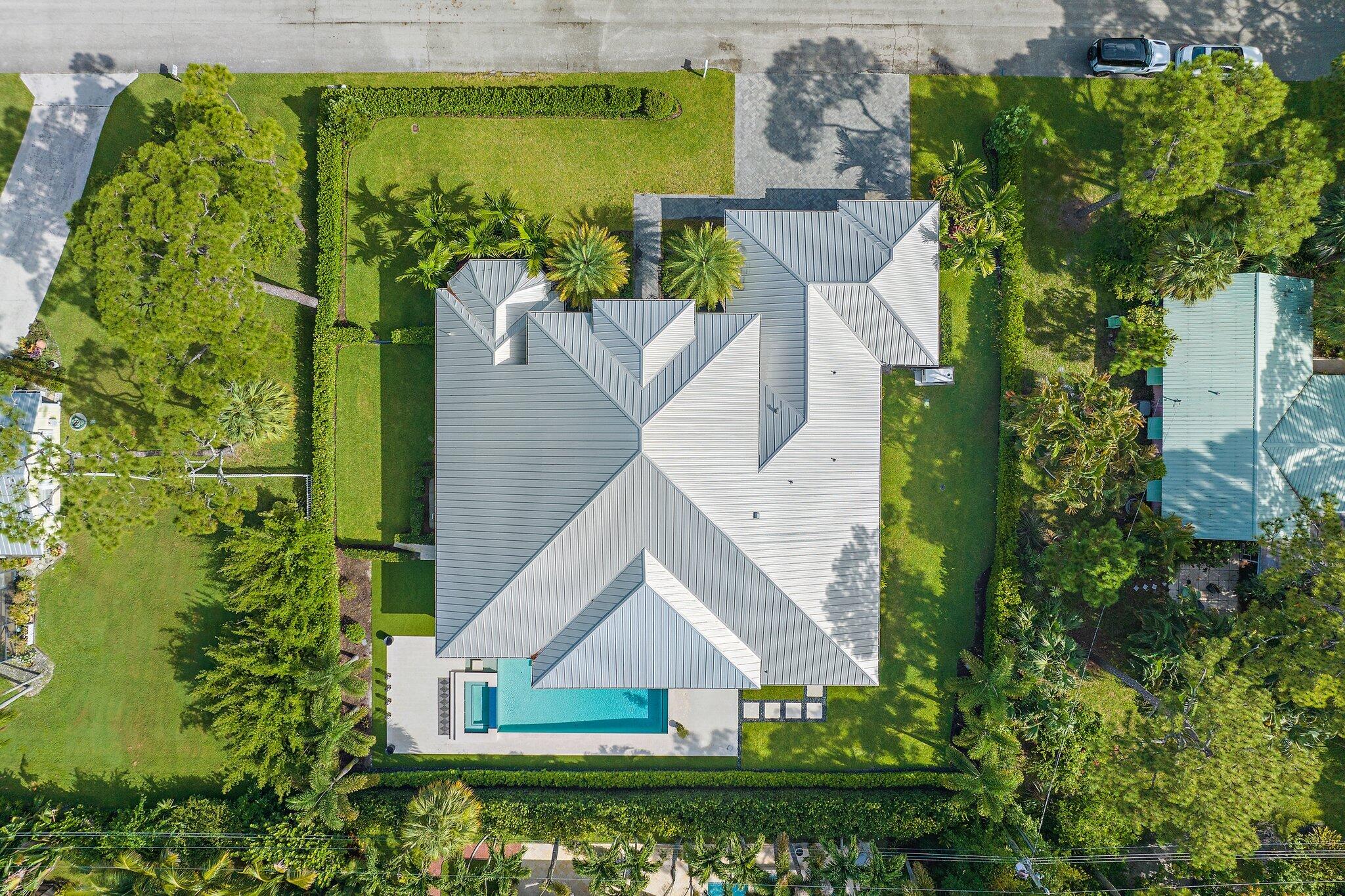 5456 Hibiscus Road Jupiter, FL 33458 - Photo 6 of 48 an aerial view of a house with a yard