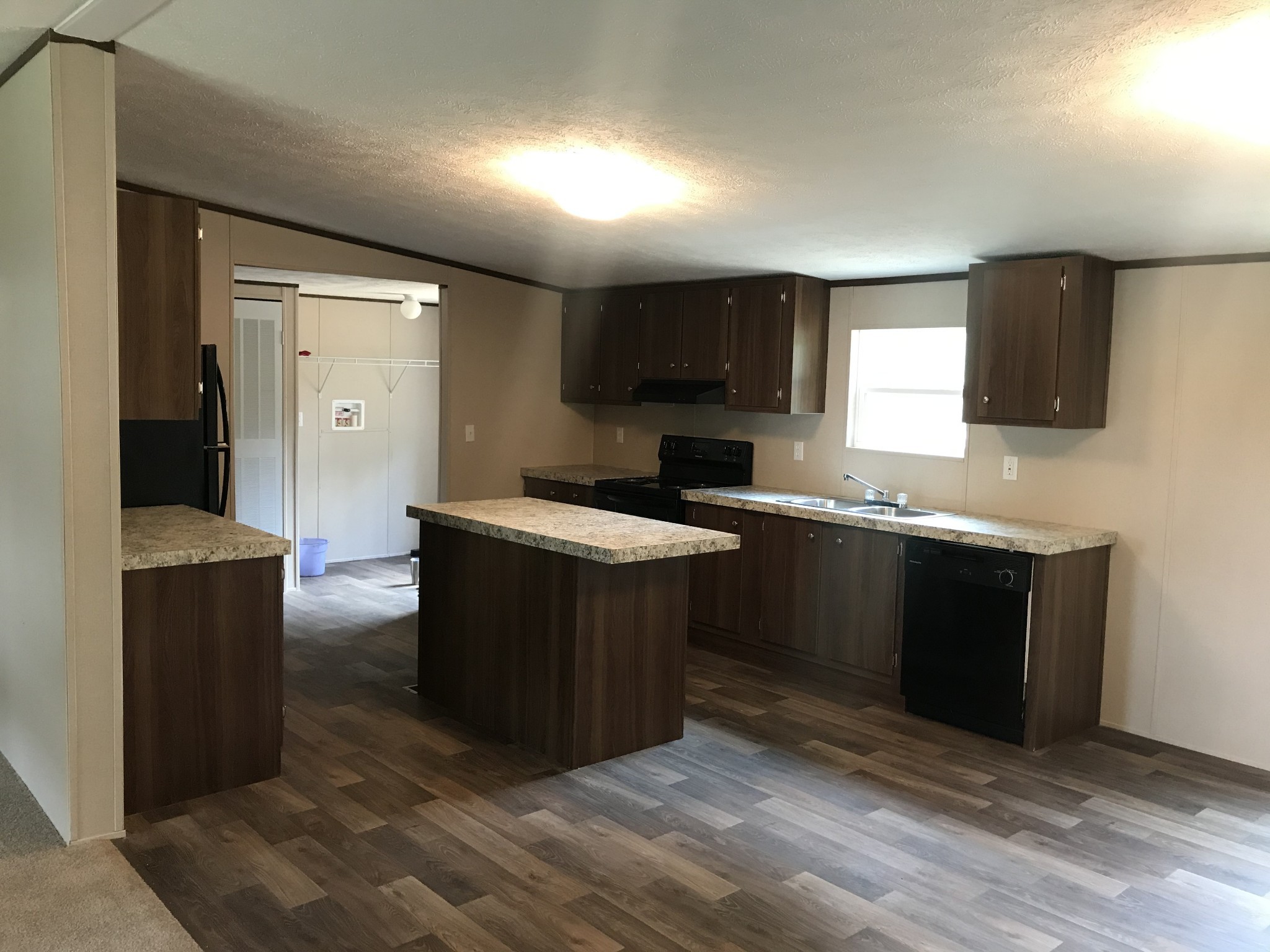 139 Harbin Road Fayetteville, TN 37334 - Photo 2 of 13 a kitchen with a sink and a stove top oven