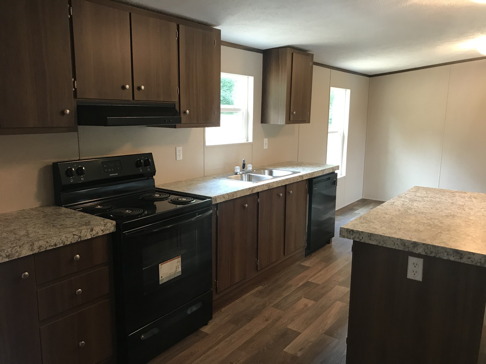 139 Harbin Road Fayetteville, TN 37334 - Photo 4 of 13 a kitchen with granite countertop a sink a stove and cabinets