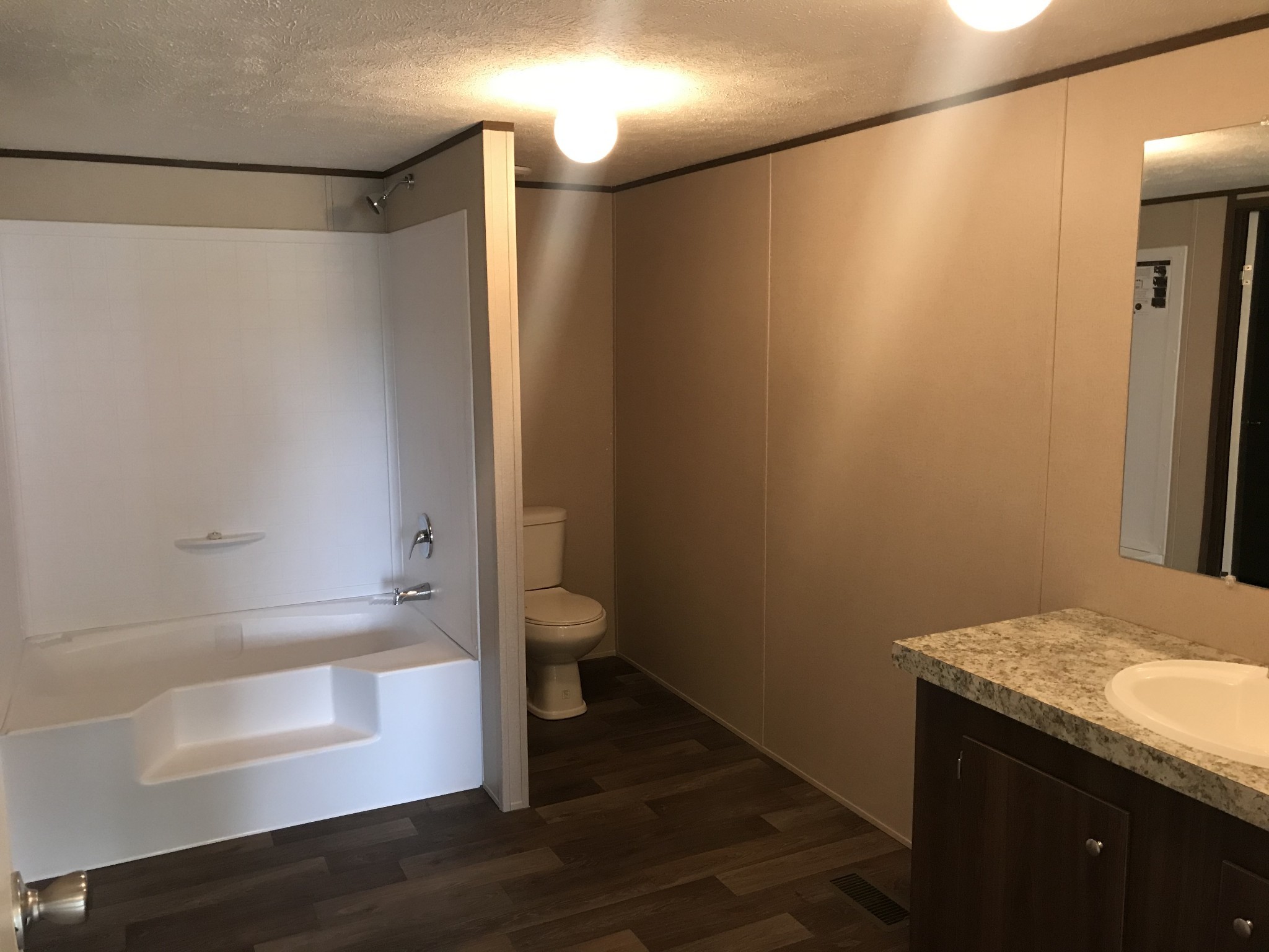 139 Harbin Road Fayetteville, TN 37334 - Photo 7 of 13 a bathroom with a granite countertop sink and a mirror