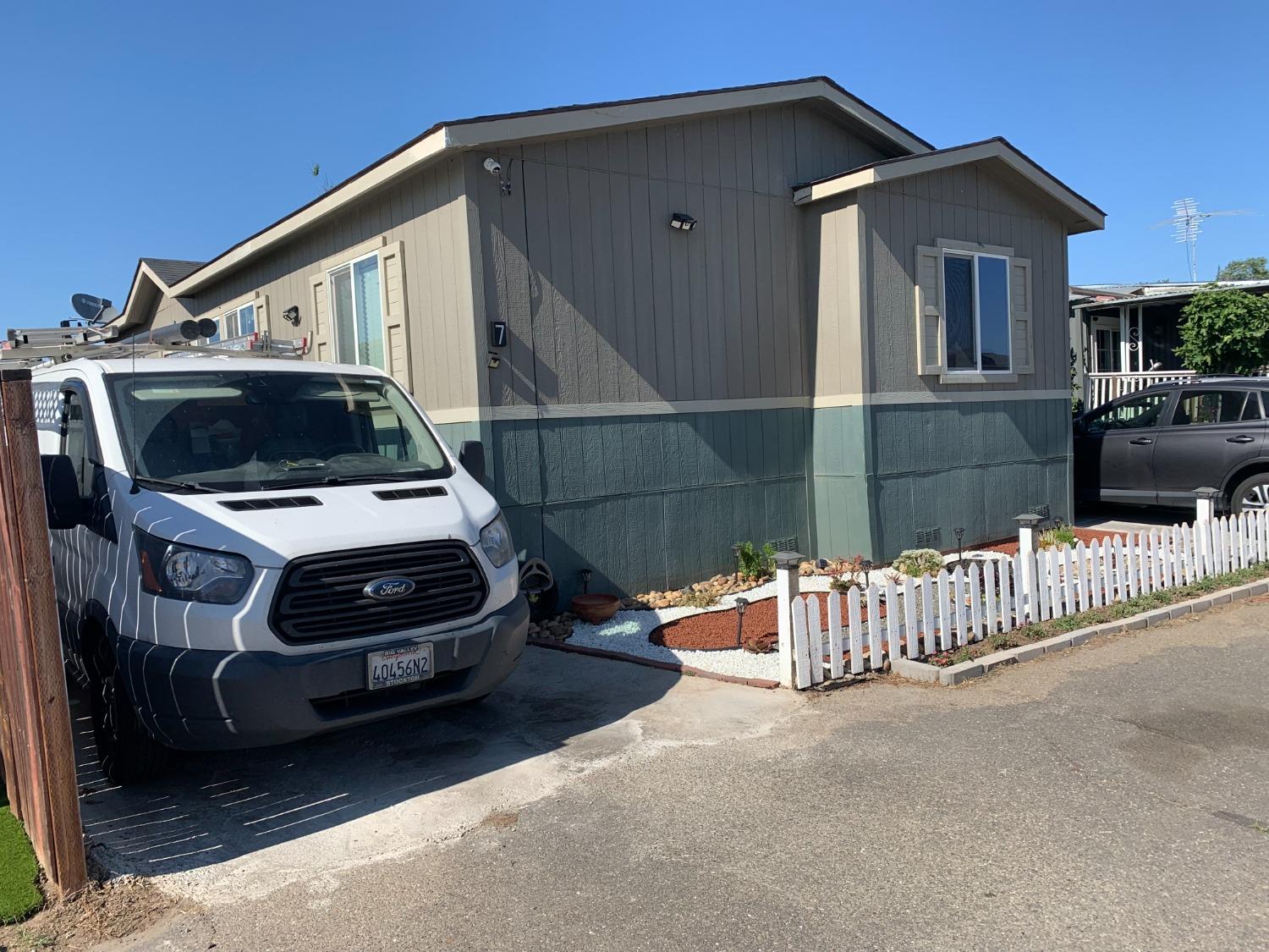 1624 South State Route 99 E Frontage Road, Unit 7 Manteca, CA 95336 - Photo 1 of 12 a car parked in front of a house