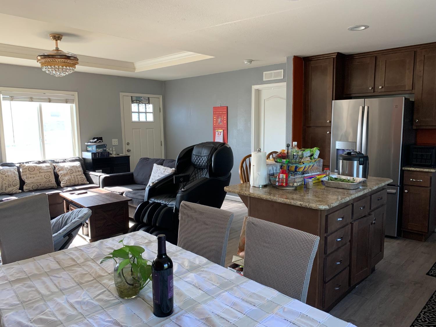 1624 South State Route 99 E Frontage Road, Unit 7 Manteca, CA 95336 - Photo 12 of 12 a living room with furniture and a window