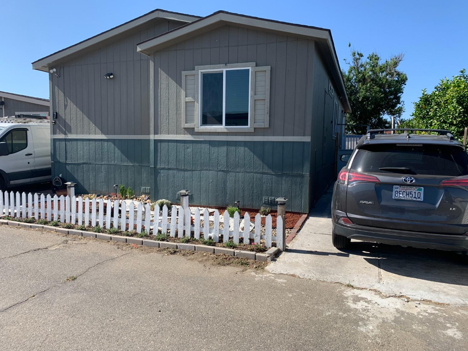 1624 South State Route 99 E Frontage Road, Unit 7 Manteca, CA 95336 - Photo 3 of 12 a view of a house with a yard