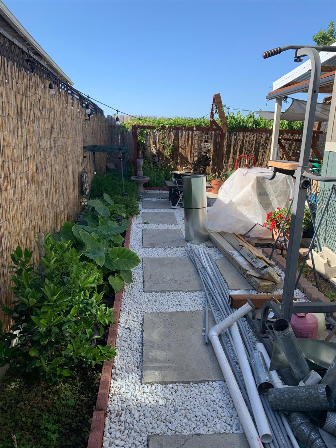1624 South State Route 99 E Frontage Road, Unit 7 Manteca, CA 95336 - Photo 5 of 12 a view of a patio with table and chairs potted plants with floor to ceiling window and potted plants