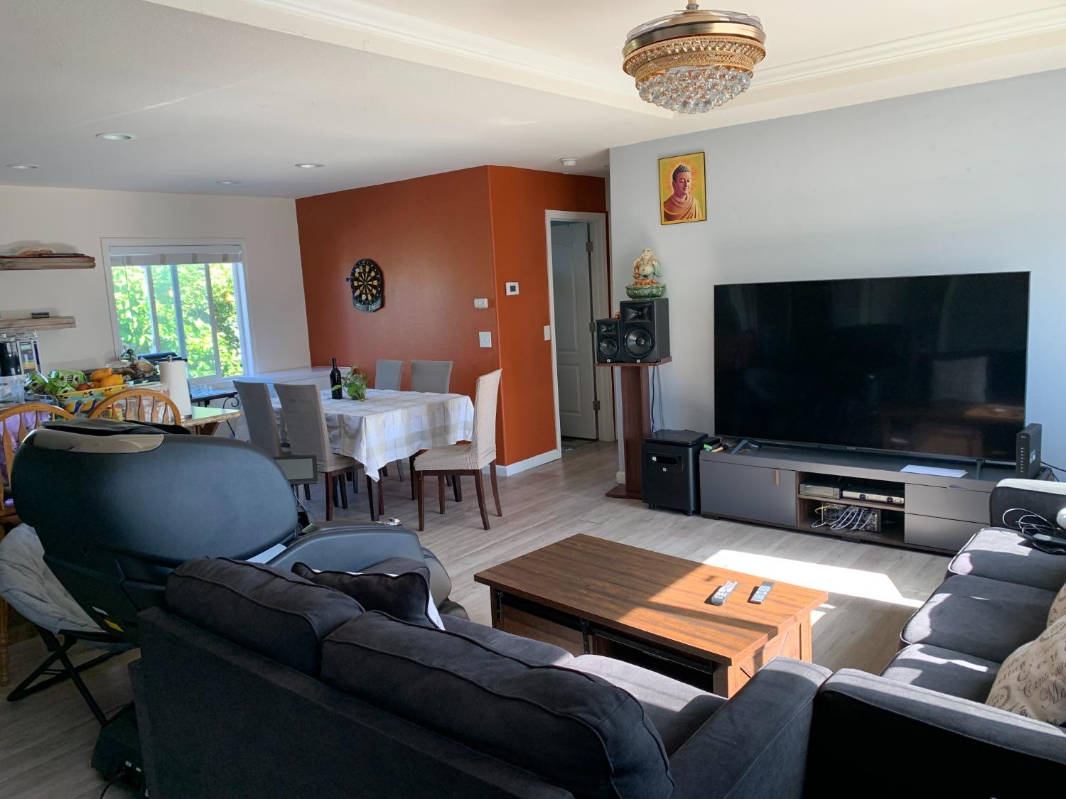 1624 South State Route 99 E Frontage Road, Unit 7 Manteca, CA 95336 - Photo 10 of 12 a living room with furniture and a flat screen tv