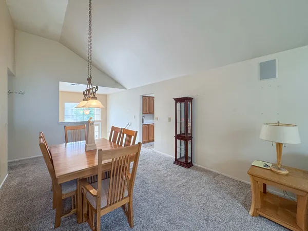 a dining room with furniture and window