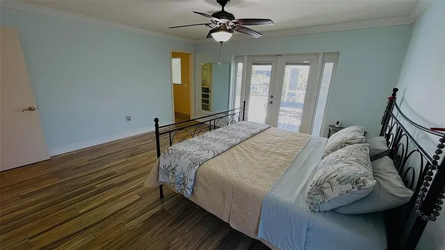 a view of a patio with a table and chairs under an umbrella