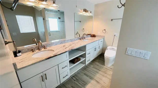 a reading room with furniture and a floor to ceiling window