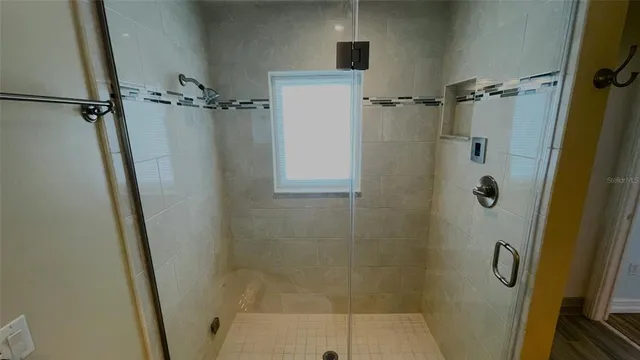 a view of a swimming pool with a chair