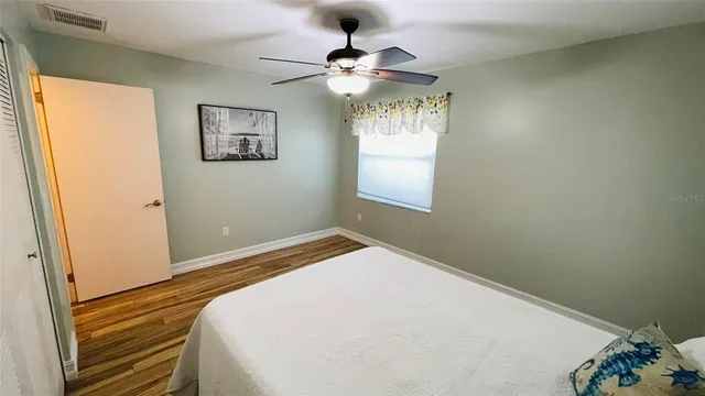 a view of swimming pool with palm trees