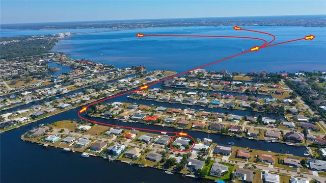 a view of a hallway to dining room with furniture