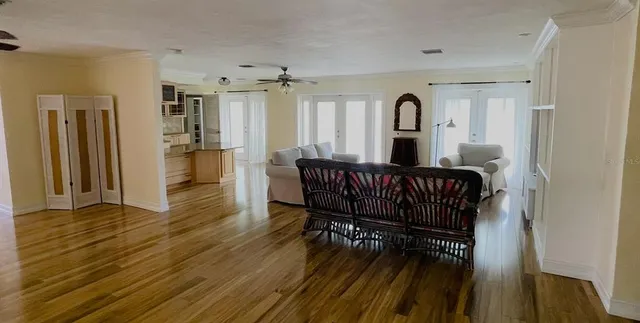 a kitchen with stainless steel appliances granite countertop a sink a stove a microwave a refrigerator and cabinets