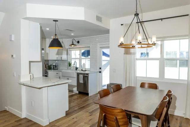 a open kitchen with a table and chairs in it