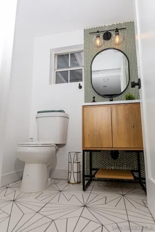 a bathroom with a toilet and a sink
