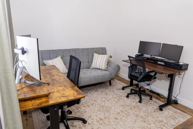 a view of a workspace with furniture and a couch