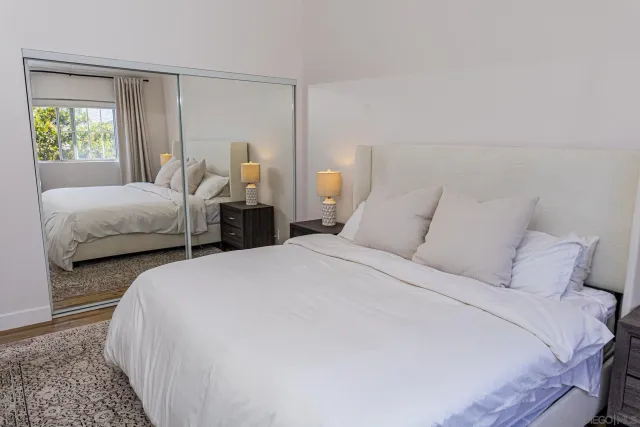 a bedroom with bed and window