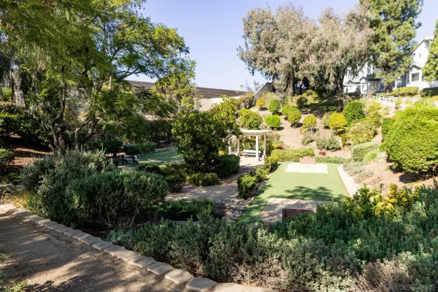 a view of a building with swimming pool and a porch