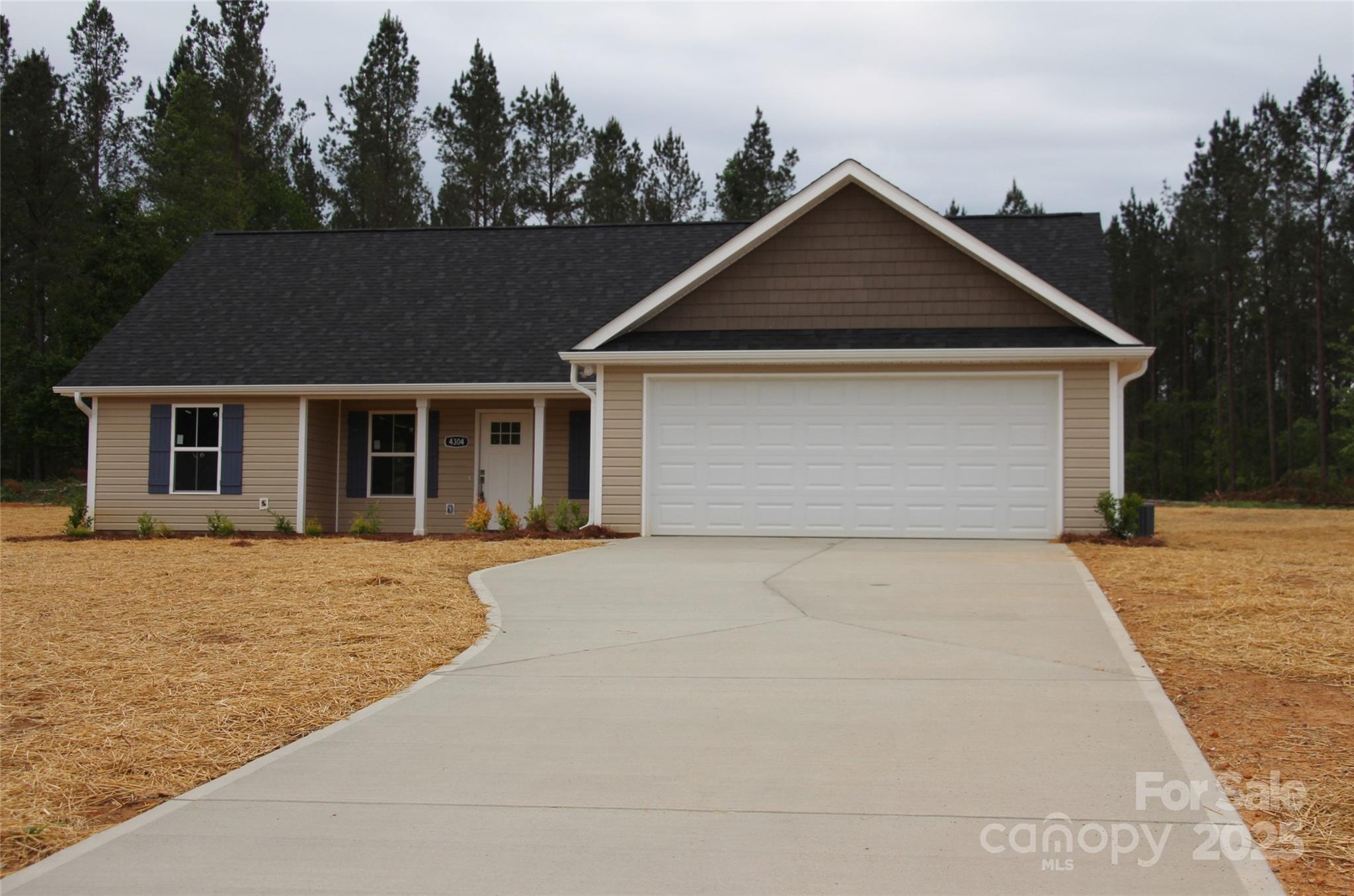 4304 Fletcher Funderburk Road Lancaster, SC 29720 - Photo 1 of 18 a front view of a house with a yard and garage