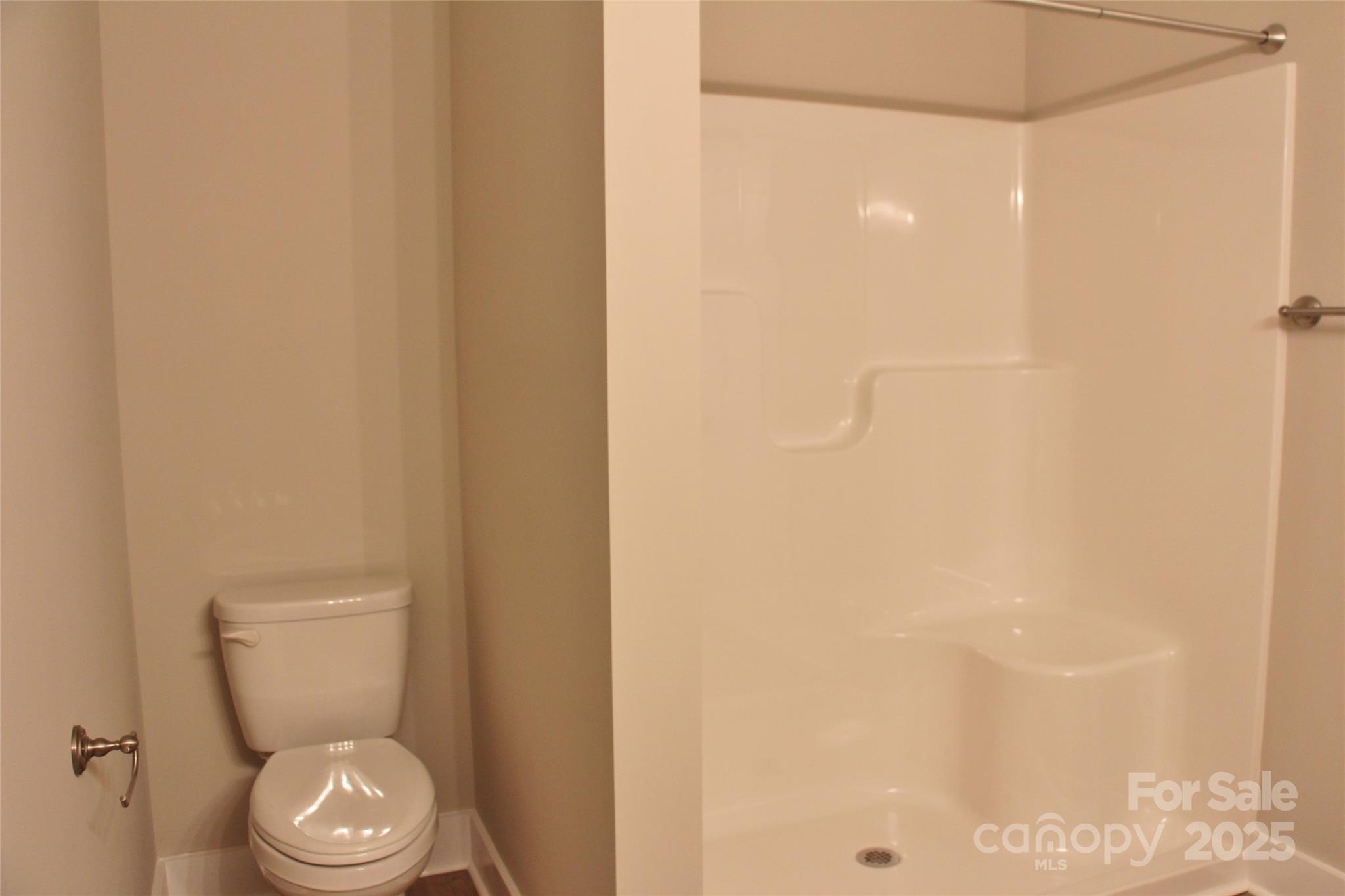 4304 Fletcher Funderburk Road Lancaster, SC 29720 - Photo 14 of 18 a white toilet sitting next to a shower