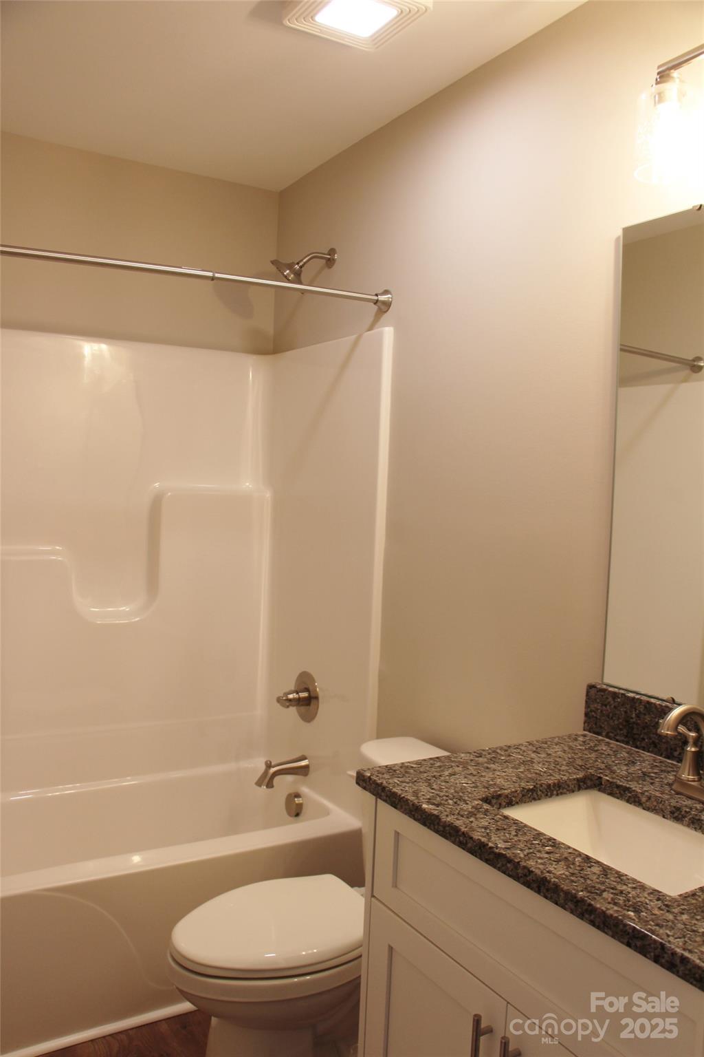 4304 Fletcher Funderburk Road Lancaster, SC 29720 - Photo 16 of 18 a bathroom with a granite countertop bathtub shower sink vanity and toilet
