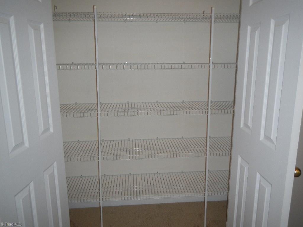 1917 Foust Road Greensboro, NC 27405 - Photo 8 of 25 One of two linen closets in the loft.