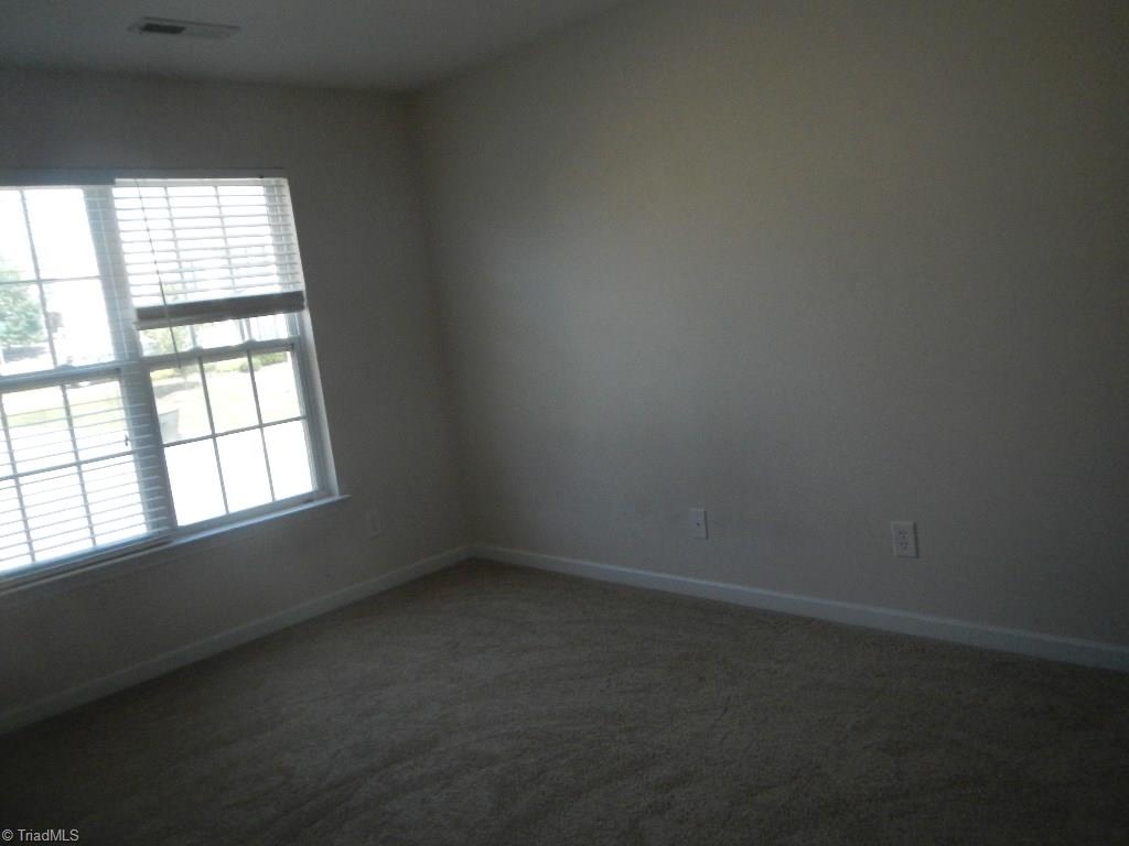 1917 Foust Road Greensboro, NC 27405 - Photo 10 of 25 Bedroom 2 faces front of the home.