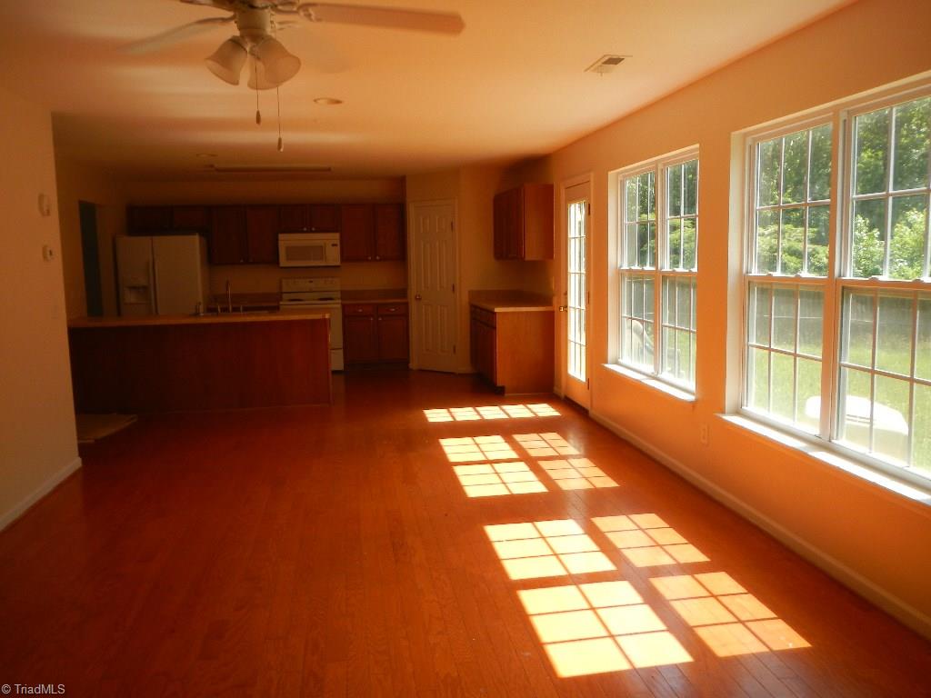 1917 Foust Road Greensboro, NC 27405 - Photo 25 of 25 Open floor plan, beautiful hardwoods, lots of natural light and privacy fence.