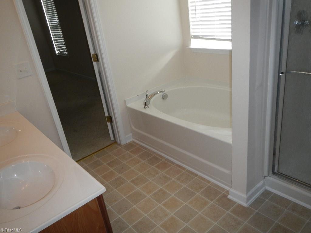 1917 Foust Road Greensboro, NC 27405 - Photo 6 of 25 Master bathroom, double vanity, separate tub and shower.